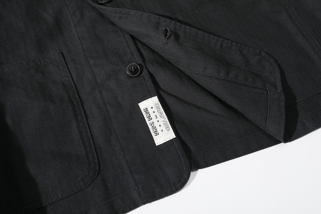 ih black french work jacket bottom hem corozo button and brand woven label