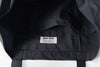 close up of quick access slot pocket detail on incense harbour black outdoor tote