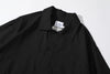 close up of polo collar and neck detail on incense harbour black seersucker shirt