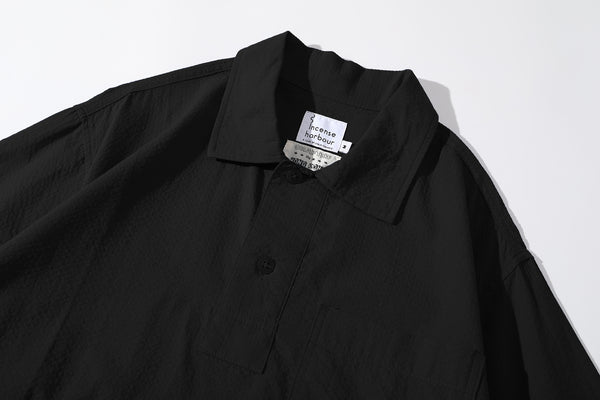 close up of polo collar and neck detail on incense harbour black seersucker shirt