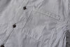close up of mitered stripe contrast chest pocket on black vertical stripe shirt