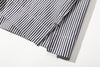 close up of side vents at hem for mobility and drape on relaxed boxy fit shirt