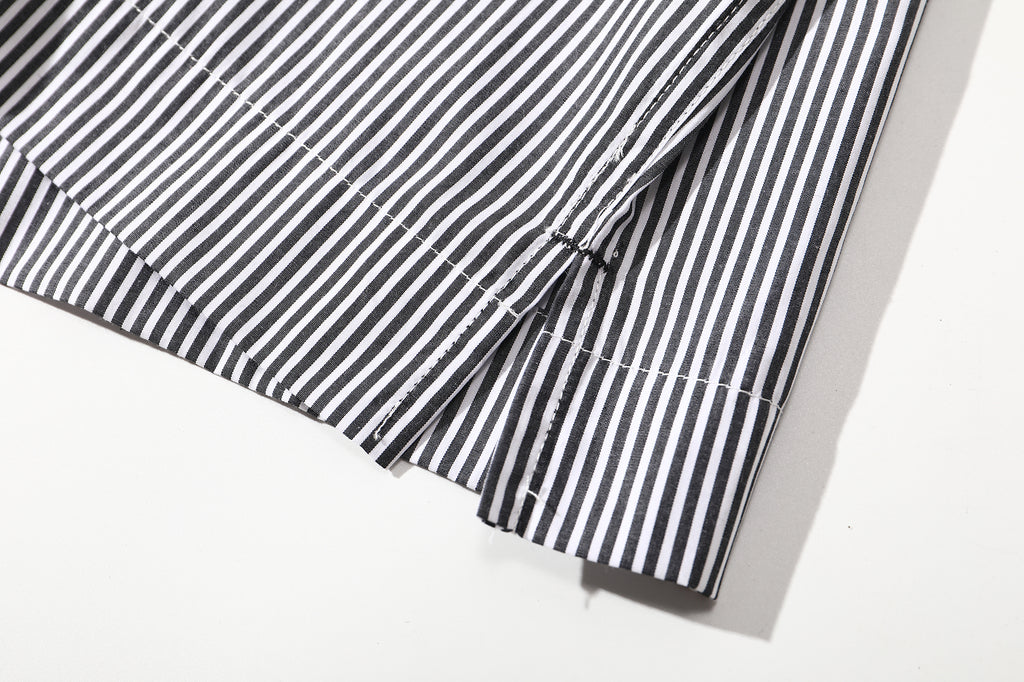 close up of side vents at hem for mobility and drape on relaxed boxy fit shirt