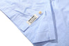close up of corozo button closure and front placket detail on incense harbour sky blue shirt