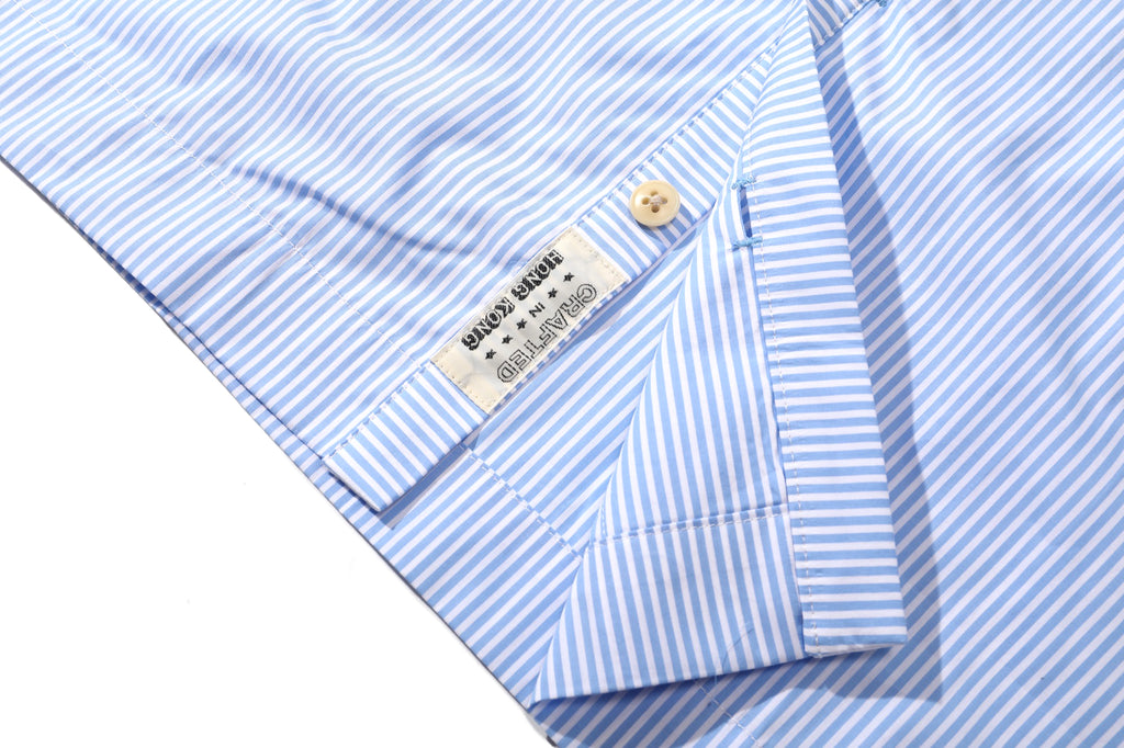 close up of corozo button closure and front placket detail on incense harbour sky blue shirt