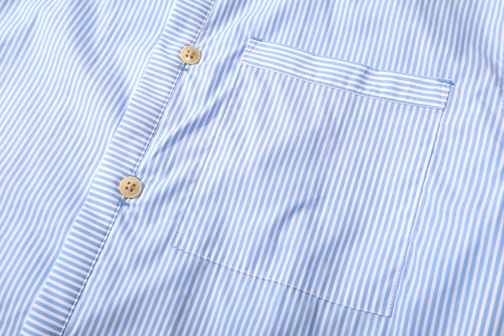 close up of chest pocket with mitered stripe detail on incense harbour sky blue summer shirt
