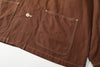 close up of front lower patch pockets showing prominent contrast stitching on edges