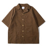 Front view of a Hong Kong made ih relaxed fit seersucker raglan chore summer shirt in brown