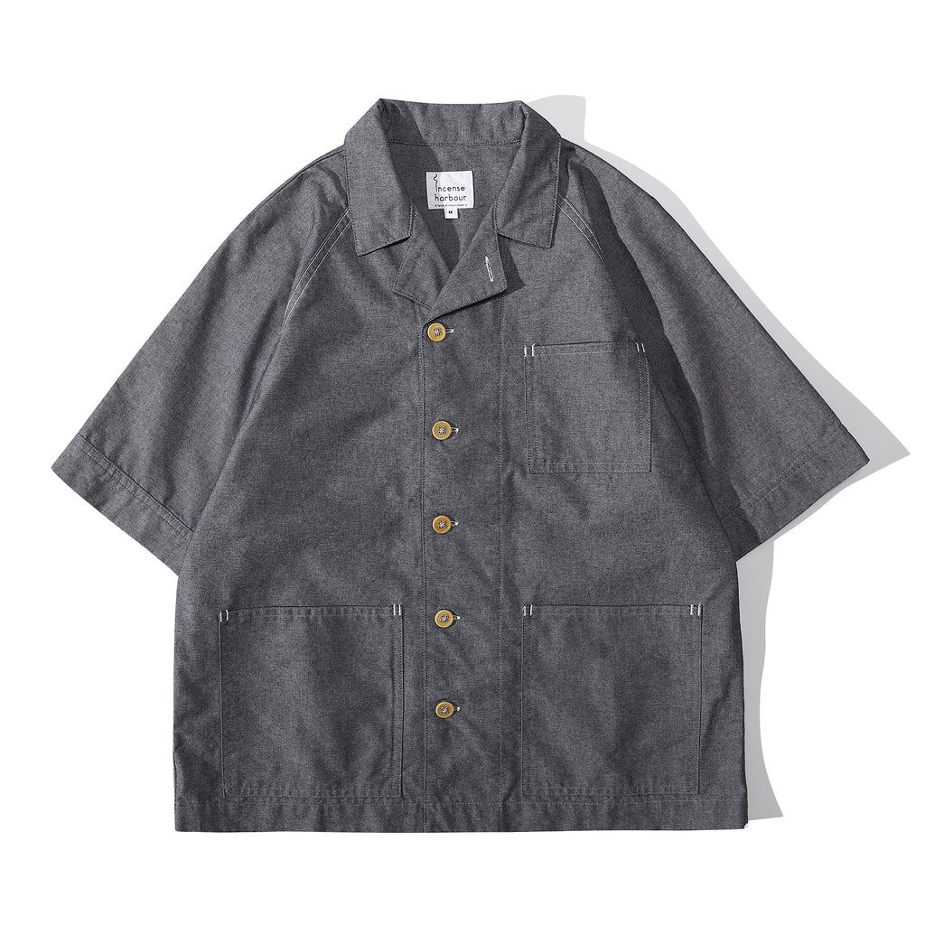 Front view of a Hong Kong made ih relaxed fit summer raglan chore shirt in chambray blue
