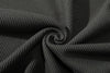 close up of ih charcoal jumper textured cotton waffle knit fabric