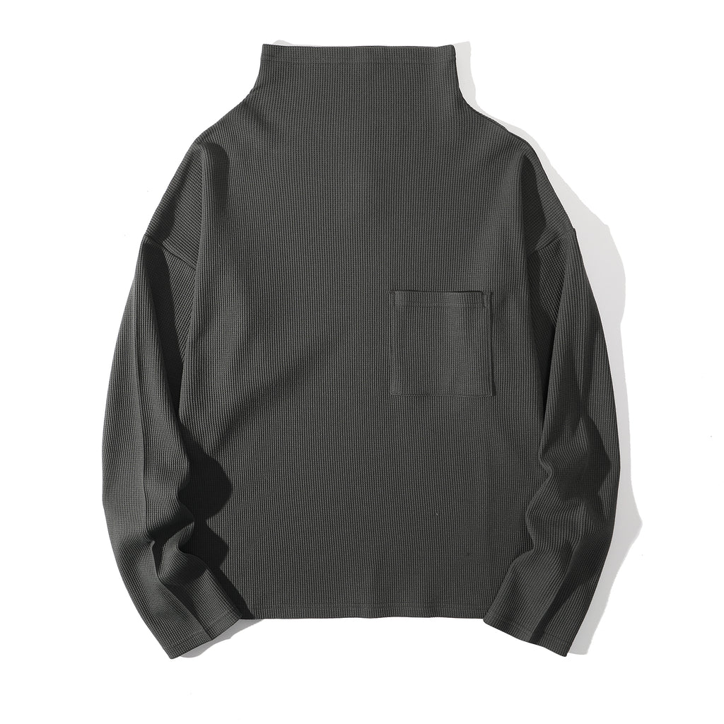 Front view of a Hong Kong made ih cotton waffle turtle neck jumper in charcoal front view