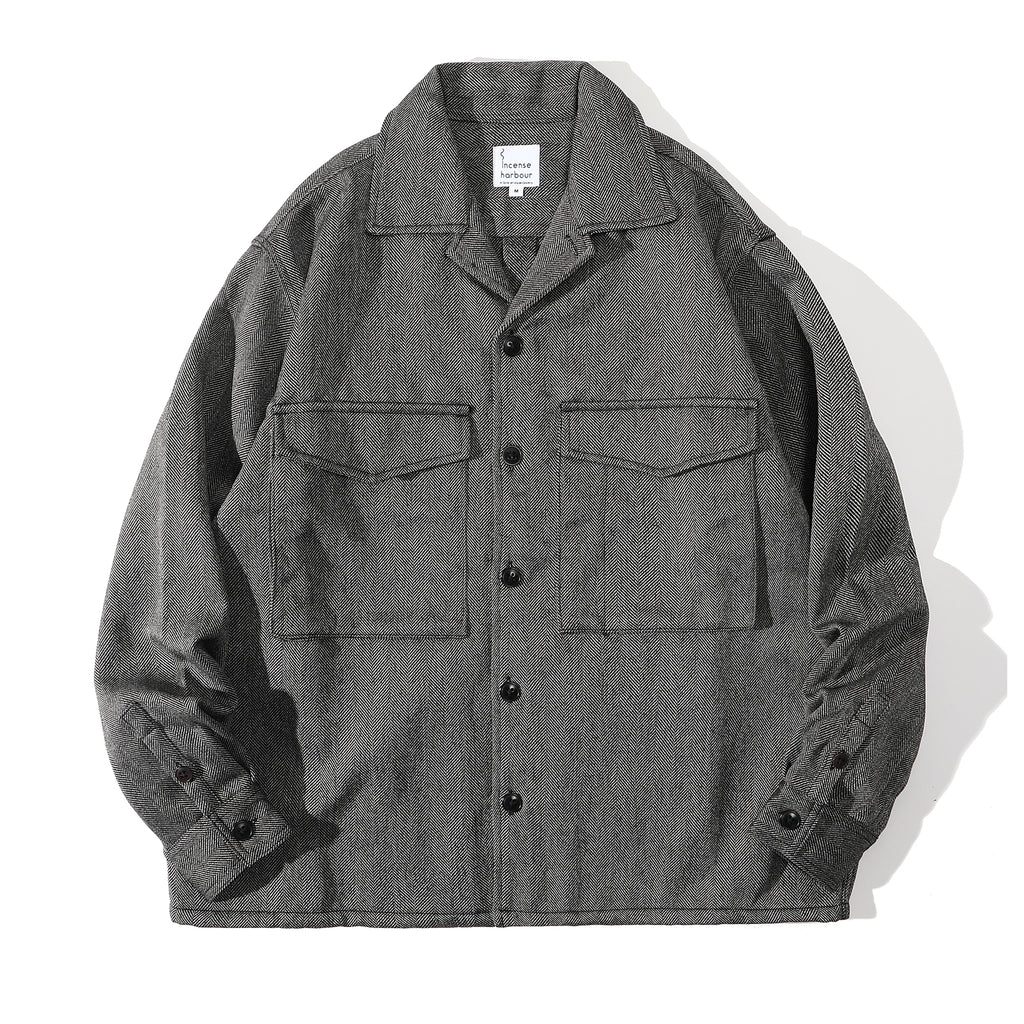 Front view of a Hong Kong made ih travel jacket in grey herringbone recycled wool tweed front view