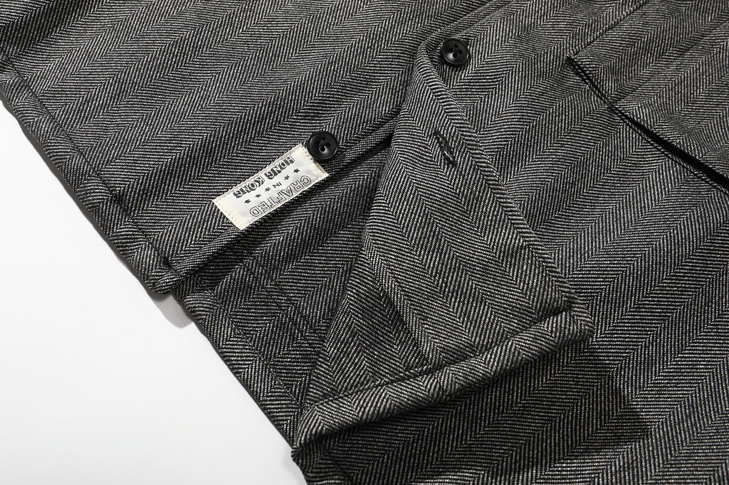 ih grey herringbone wool jacket bottom hem corozo button and brand woven label detail