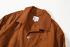 close up of neat collar design and collar stand on mud yellow relaxed cut shirt