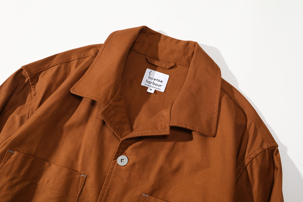 close up of neat collar design and collar stand on mud yellow relaxed cut shirt