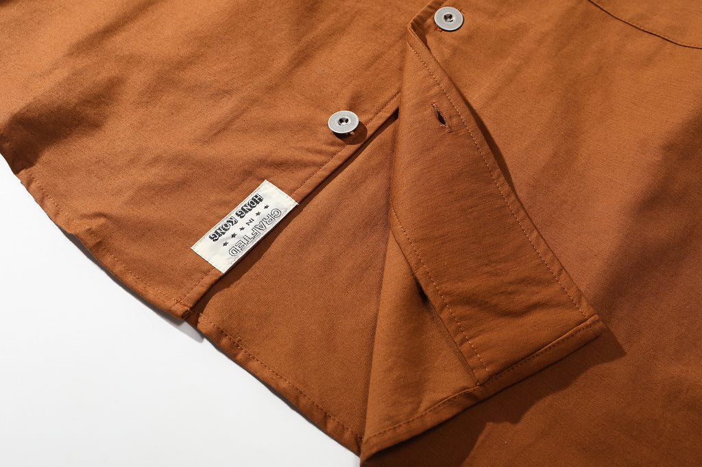close up of classic curved hem design on relaxed cut cotton shirt
