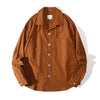 Front view of a Hong Kong made mud yellow cotton sateen shirt front view