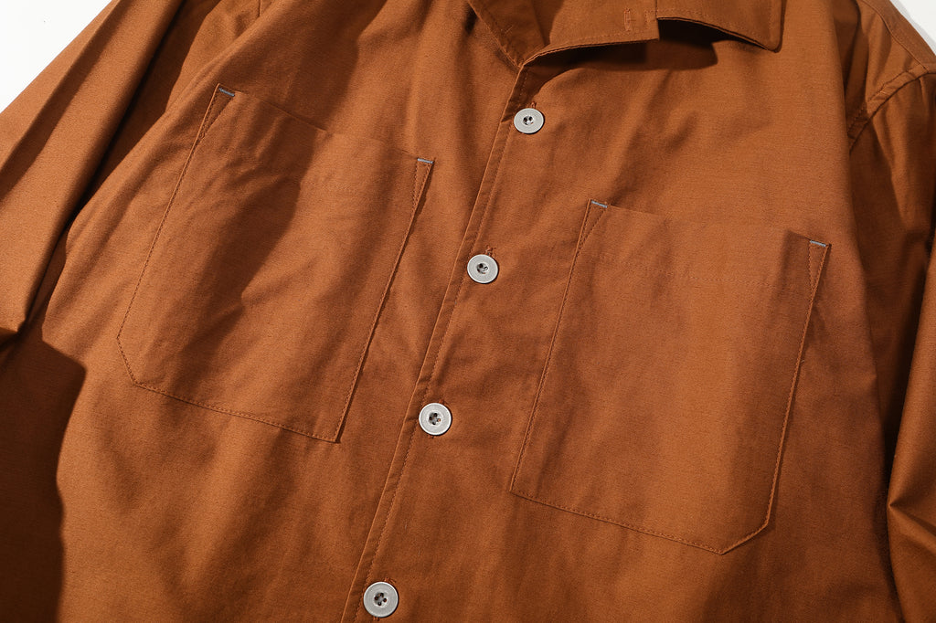 close up of front closure featuring premium metal buttons from Japan YKK