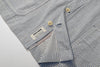 close up of front hem construction on relaxed fit jacket