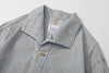 close up of unique swallow collar and neckline design on navy stripe jacket