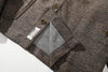 close up of jacket lower hem design and original craft label