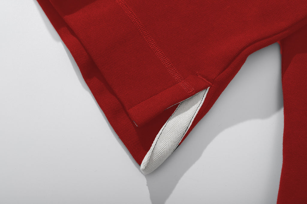 ih red turtleneck jumper detailed view of high low hem and side vents 