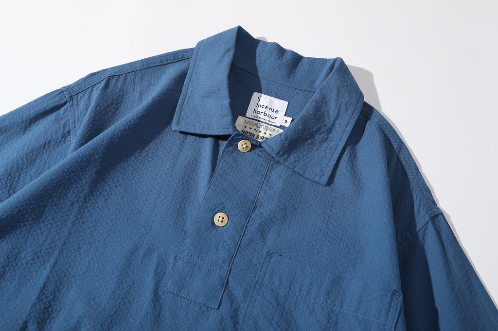ih steel blue seersucker polo shirt  collar and corozo button closure details