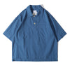 Front view of a Hong Kong made ih relaxed fit boxy cut polo collar seersucker shirt in steel blue