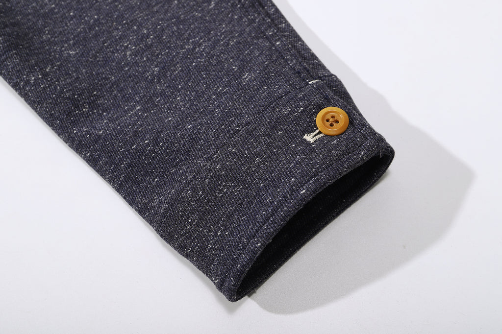 ih stone blue crop work jacket close up of sleeve cuffs and corozo button