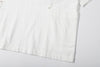ih textured white cotton shirt detailed view of the large patch pockets across both side seams