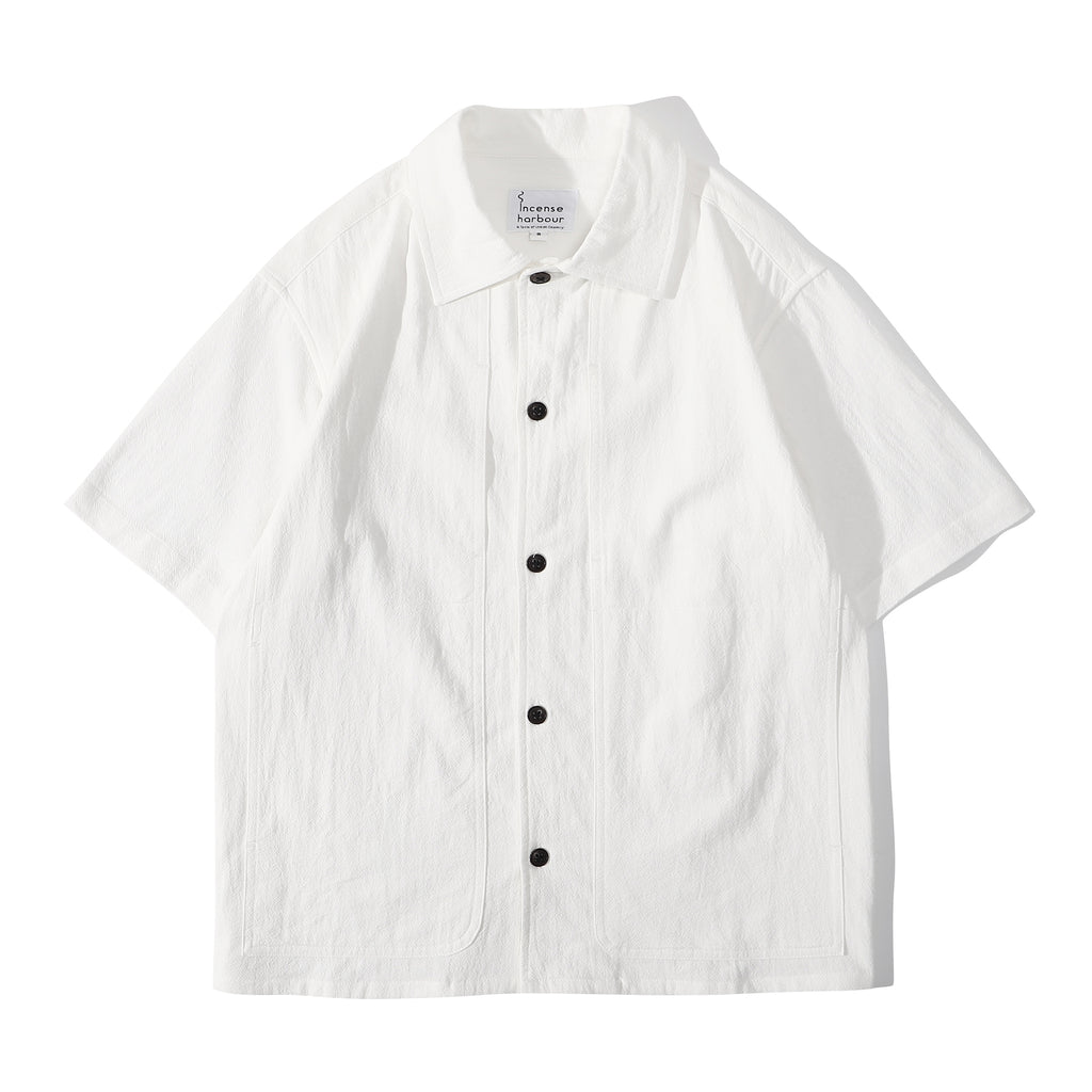 Front view of a Hong Kong made ih relaxed fit and boxy cut textured summer shirt in white