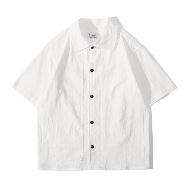 Front view of a Hong Kong made ih relaxed fit and boxy cut textured summer shirt in white