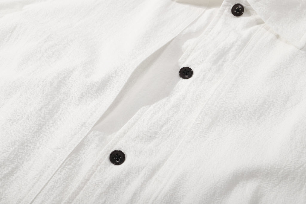 ih textured white cotton shirt detailed close up view of the hidden pockets