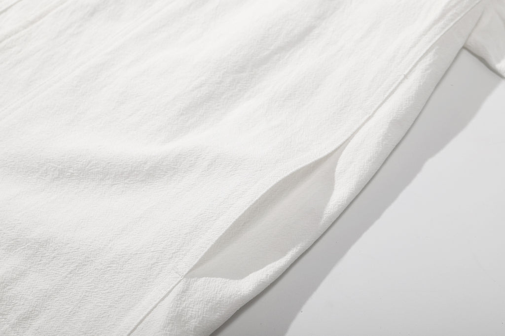 ih textured white cotton shirt detailed close up view of the side pockets design
