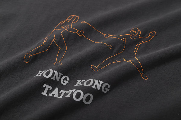ih white cotton t shirt close up of the tattoo inspired fencing embroidery and heat transferred wording
