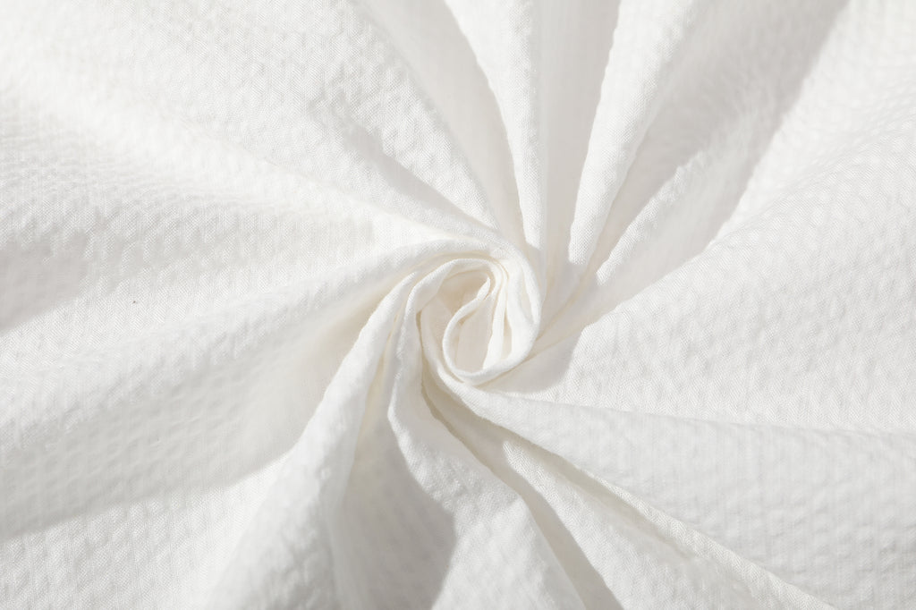 detailed close up texture of ih white premium cotton seersucker fabric