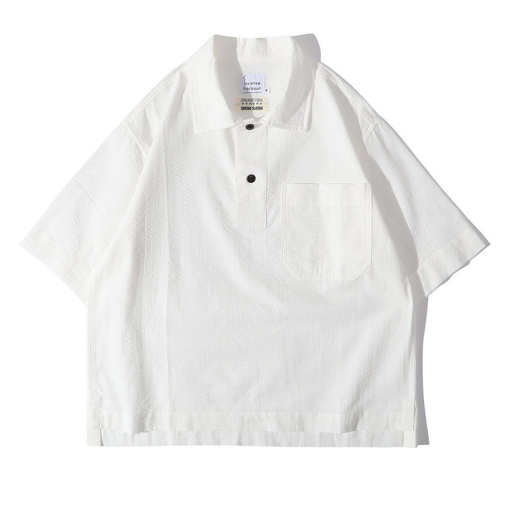 Front view of a Hong Kong made ih relaxed fit seersucker polo shirt in white