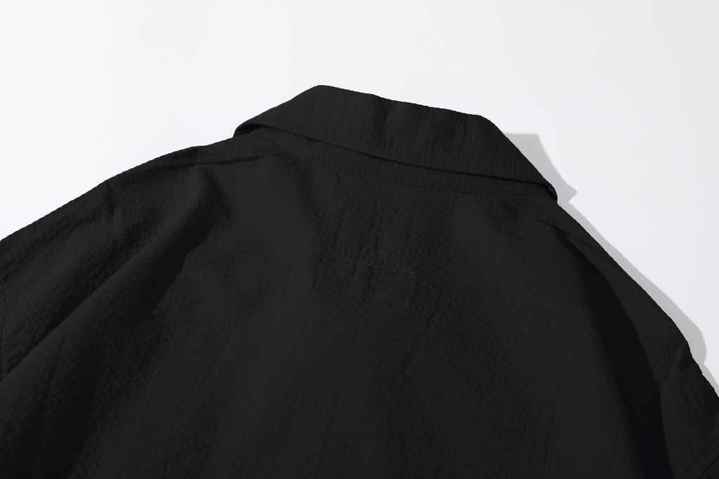 close up of back collar and neck area detail on incense harbour black seersucker shirt