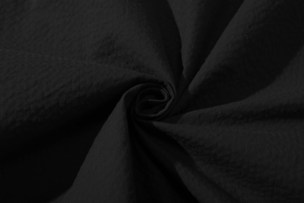 close up of premium black seersucker fabric texturing on incense harbour shirt