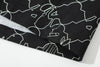 hem view of a Hong Kong made GOC Studio black lucky bamboo Tencel linen shirt