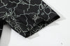close up of sleeve hem and stitching detail on a Hong Kong made GOC Studio black lucky bamboo Tencel linen shirt