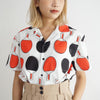 female model mid-shot of a Hong Kong made GOC Studio black and red ping pong cotton poplin shirt
