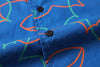 close up of corozo button closure on a Hong Kong made GOC Studio blue daffodil cotton poplin shirt