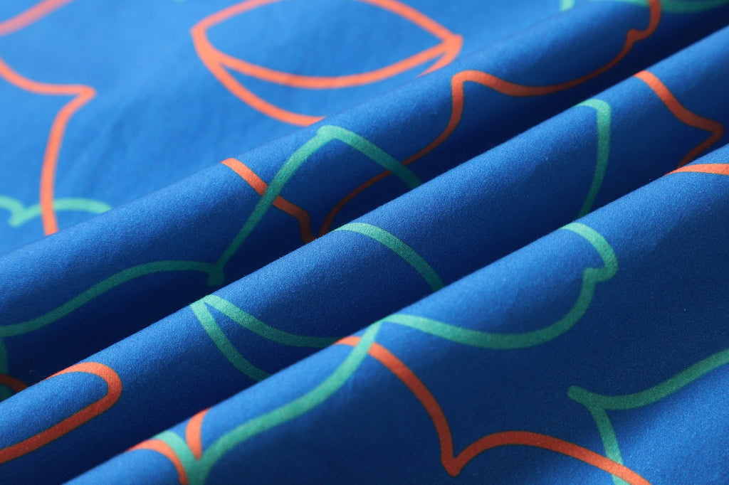 close up of blue daffodil cotton poplin fabric texture