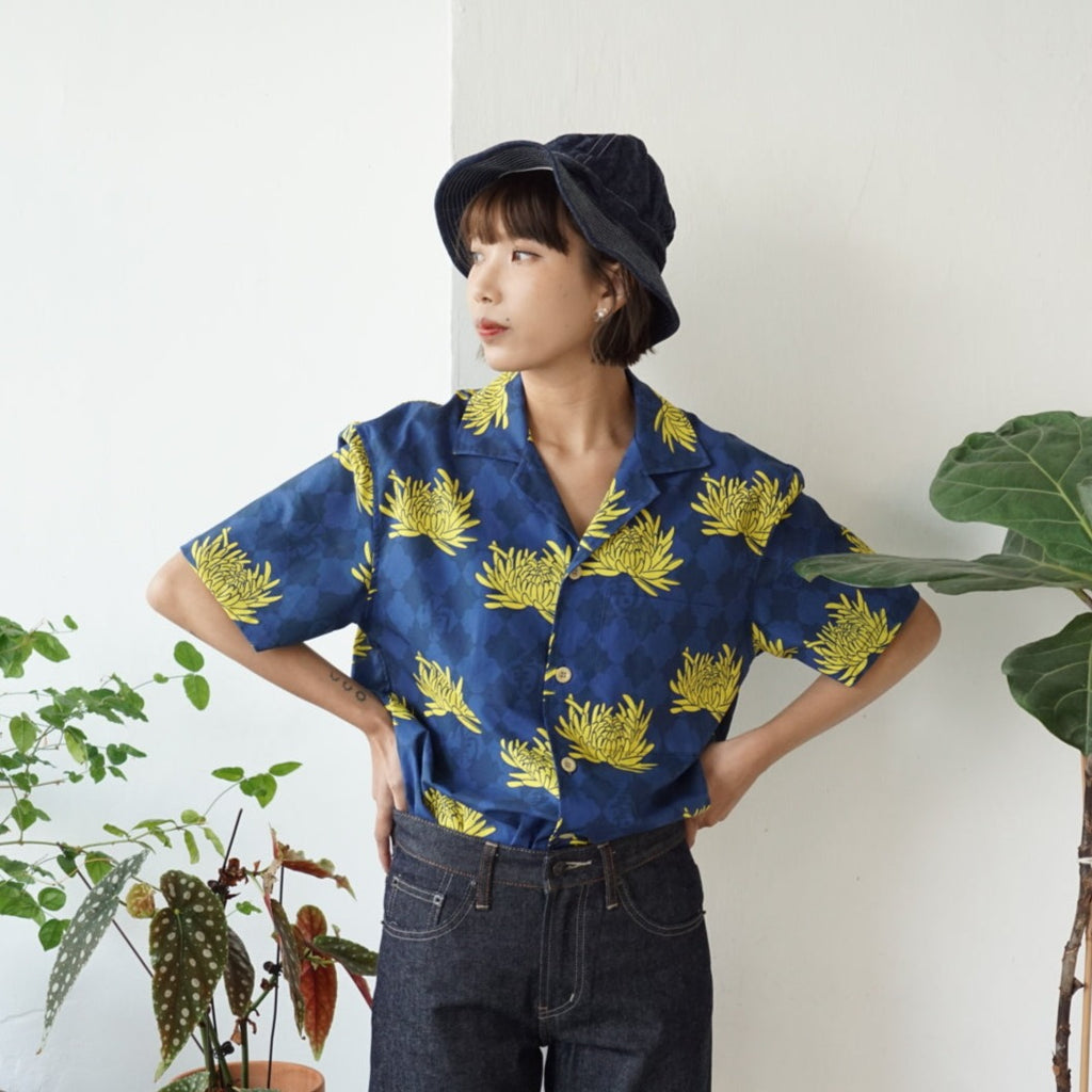 female model front mid-shot of a Hong Kong made GOC Studio blue and yellow chrysanthemum cotton shirt