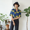female model front mid-shot of a Hong Kong made GOC Studio blue and yellow chrysanthemum cotton shirt