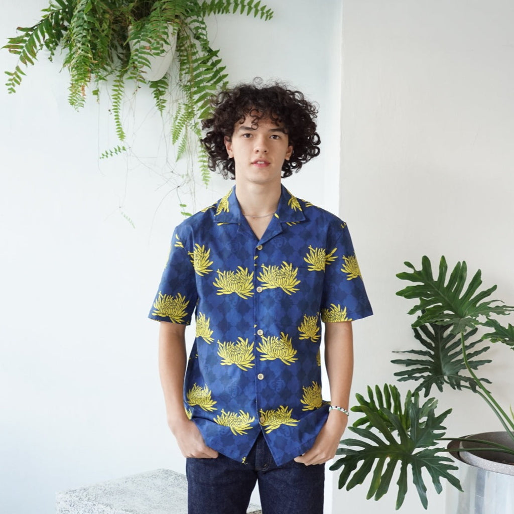 male model front mid-shot of a Hong Kong made GOC Studio blue and yellow chrysanthemum cotton shirt