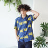 male model front mid-shot of a Hong Kong made GOC Studio blue and yellow chrysanthemum cotton shirt