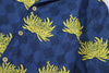 close up of matching patterned chest pocket on a Hong Kong made GOC Studio blue and yellow chrysanthemum cotton shirt