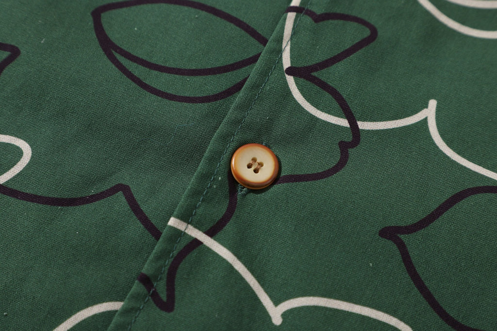 close up of corozo button closure on a Hong Kong made GOC Studio green daffodil Tencel linen shirt